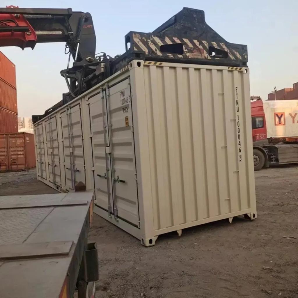 Open side container — being lifted by crane